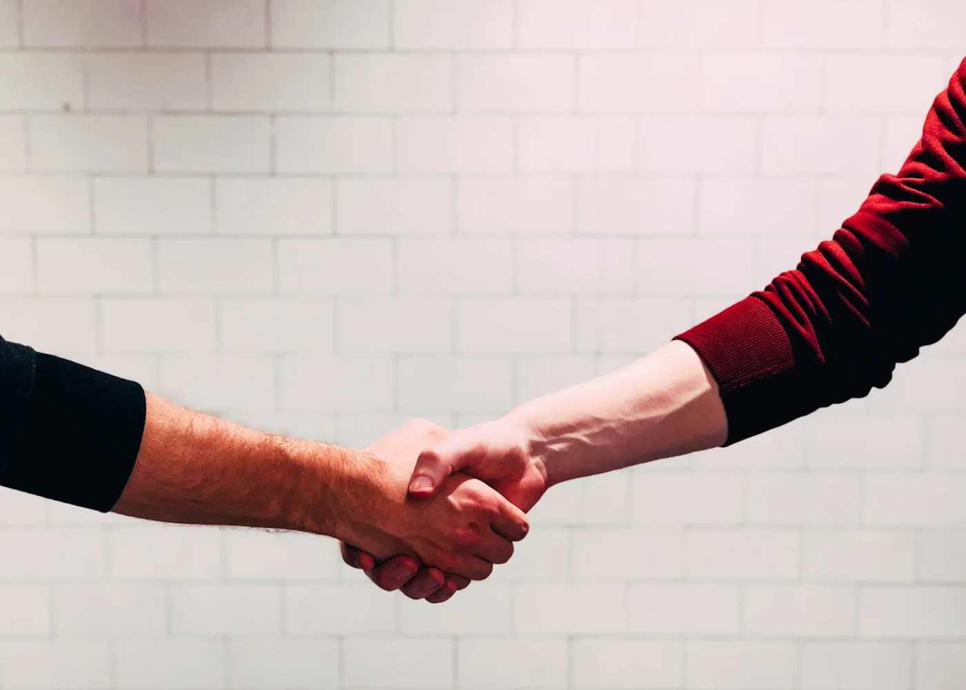 Homeowner and Generac service technician shaking hands on a maintenance plan in Atlanta, GA